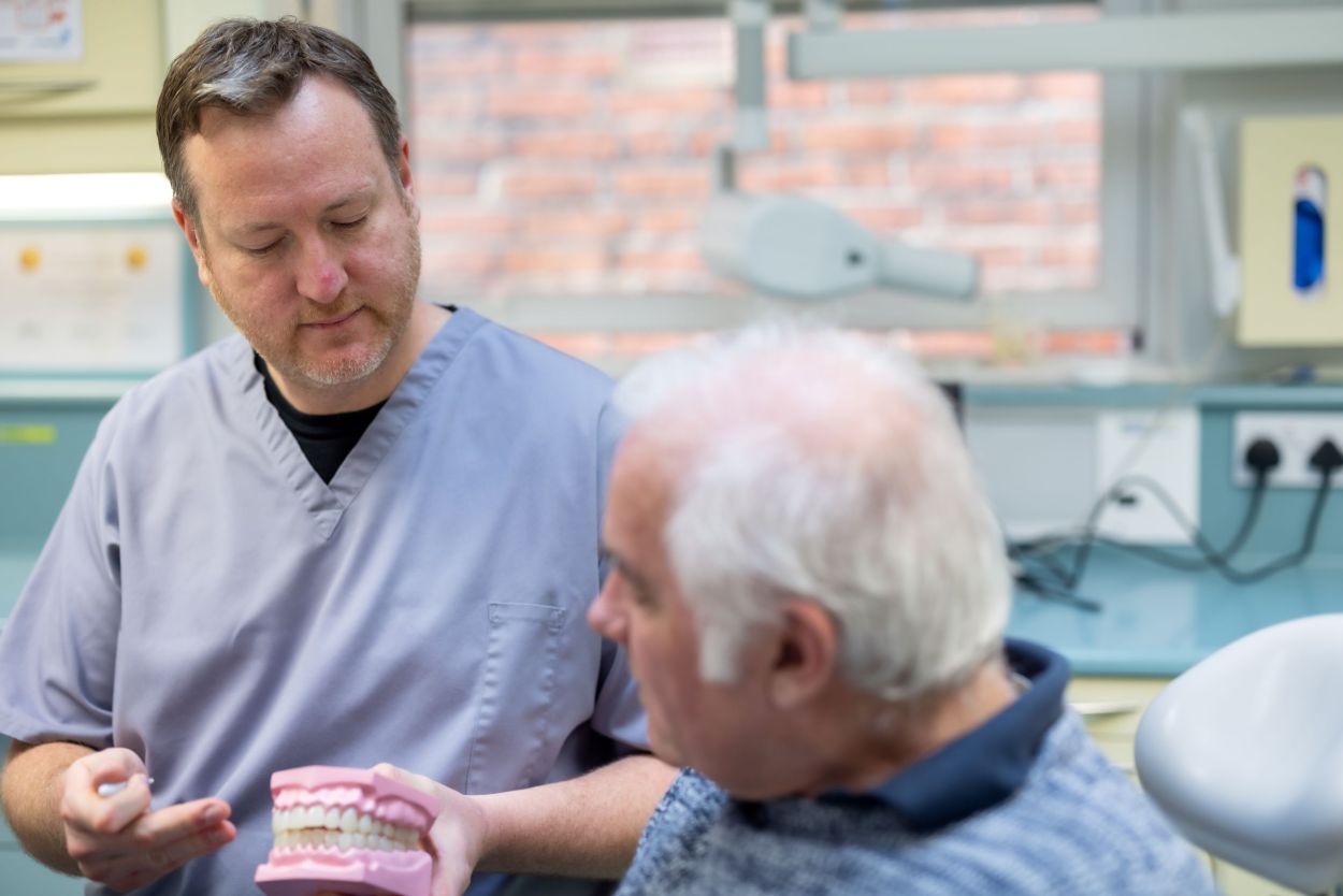 Dentist talking with a patient at Guildford Dental Centre